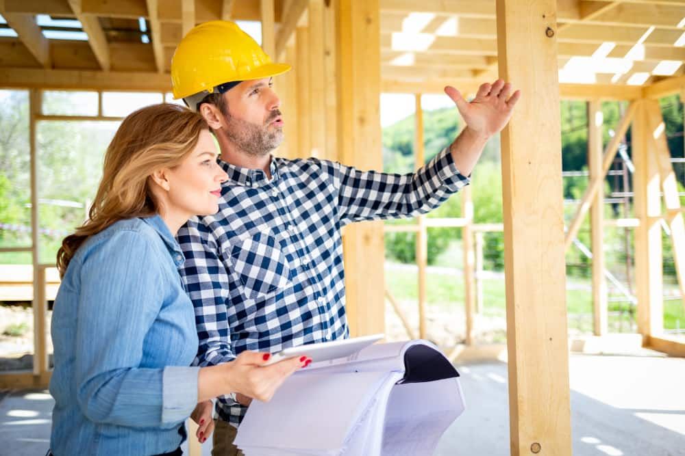 Contractor and homeowner at construction site